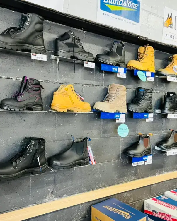 Wall of work boots including Blundstone safety boots at Custom Workwear