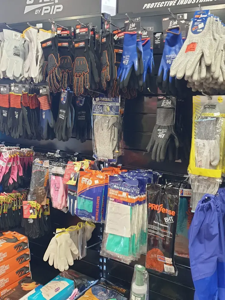 Work gloves and protective PPE on display at Custom Workwear