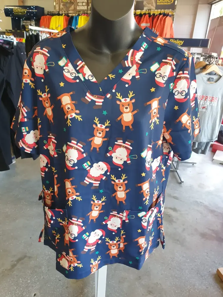 Christmas reindeer print scrub top on display at Custom Workwear