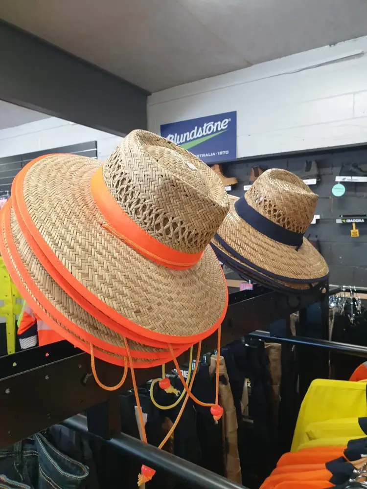 Wide-brim straw work hats with orange trim at Custom Workwear
