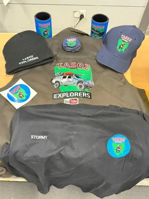 Embroidered beanie, cap and t-shirt with a custom club logo by Custom Workwear