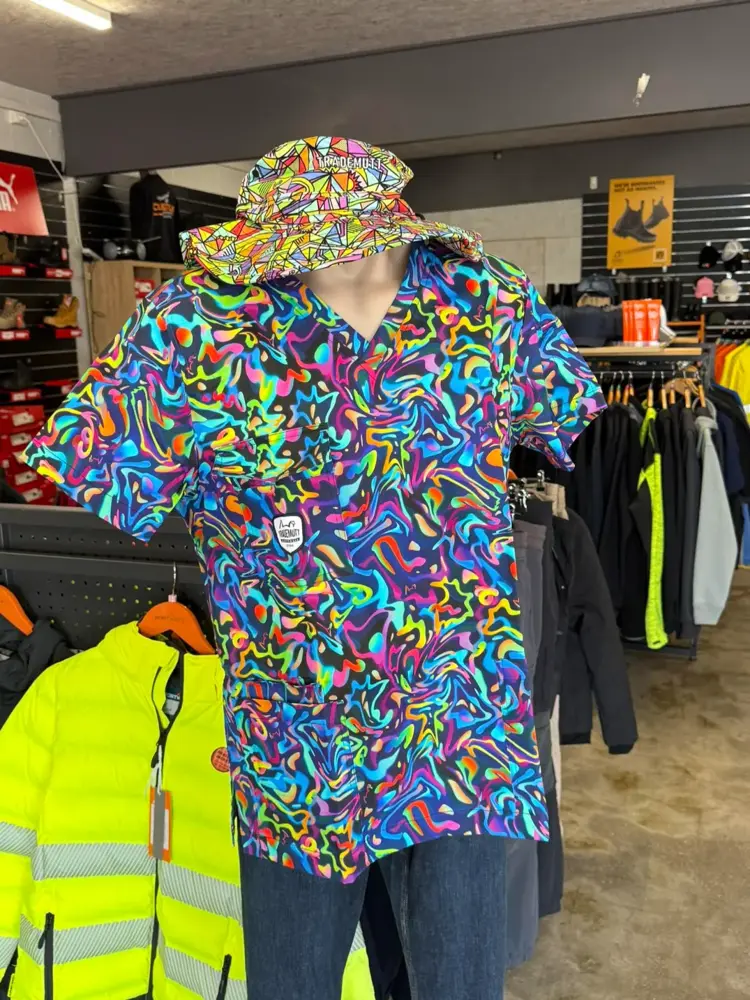 Bright patterned work shirt and bucket hat on display at Custom Workwear