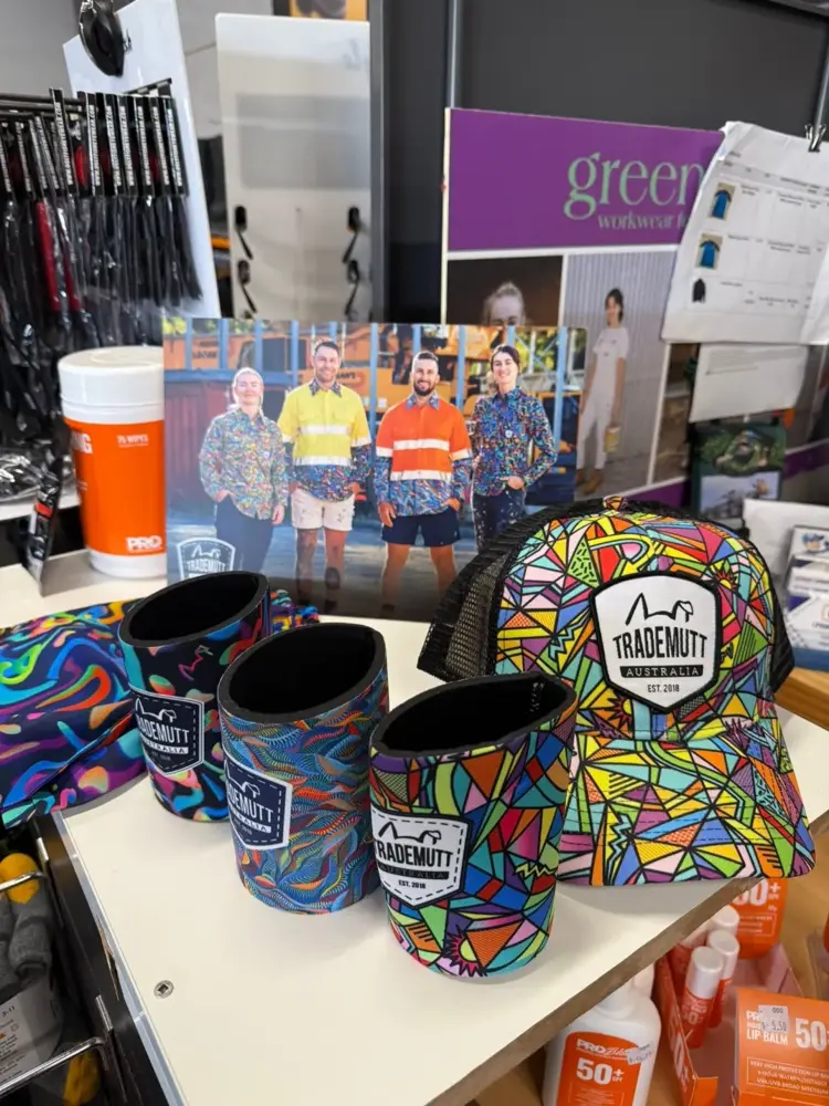 Patterned stubby coolers, caps and cooler bags on display at Custom Workwear