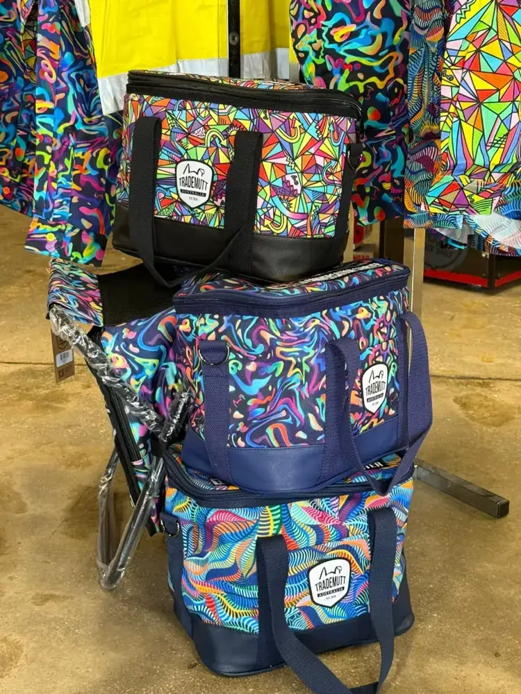 Patterned cooler bags and lunch bags stacked at Custom Workwear