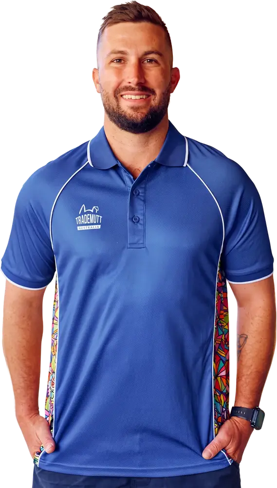 Man wearing a branded blue TradeMutt work polo with patterned side panels